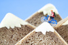 A toy cyclist is taking a ride on mountains, made of rye bread and creamy cheese. Ecotourism and healthy eating concept. All the special effects are real. I used H0 models to create this scene.