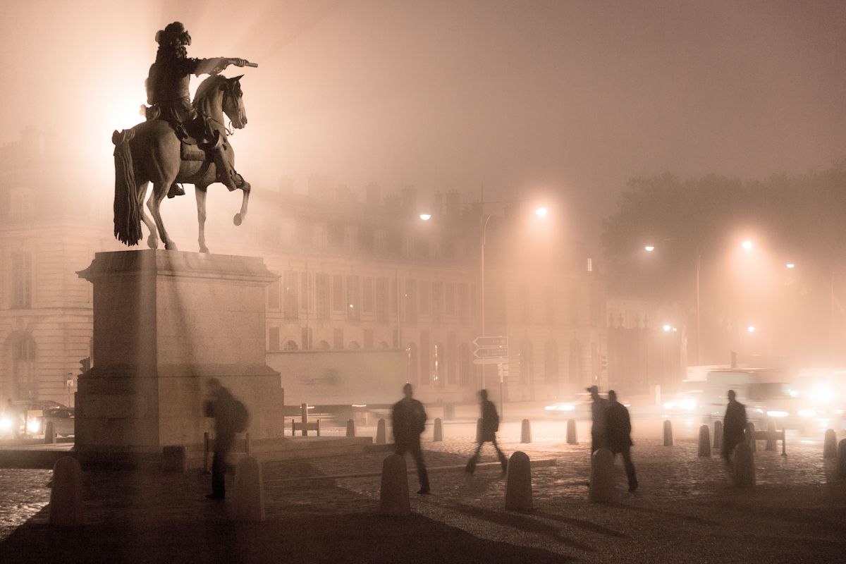 Statue of Louis XIV in the morning  fog of Paris